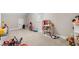 Playroom with toys, dollhouse, and shelving unit at 655 Black Pine Rd, Moncks Corner, SC 29461