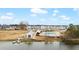 Community pool with lake view and cabana at 655 Black Pine Rd, Moncks Corner, SC 29461
