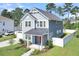 Two-story gray house with metal roof and two-car garage at 1064 Harriman Ln, Charleston, SC 29492