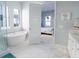 Elegant bathroom with soaking tub, walk-in shower, and marble floors at 107 Garden Lily Ln, Summerville, SC 29485