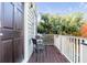 Private balcony with two chairs, overlooking treetops at 132 Spring St, Charleston, SC 29403