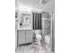 Clean bathroom with gray tile and a large shower at 132 Spring St, Charleston, SC 29403