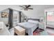 Spacious attic bedroom with two beds and a ceiling fan at 132 Spring St, Charleston, SC 29403