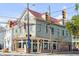 Charming two-story home with a light gray exterior and red roof at 132 Spring St, Charleston, SC 29403