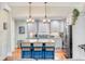 Updated kitchen featuring white cabinets, stainless steel appliances, and a large island with seating at 132 Spring St, Charleston, SC 29403