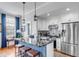Modern kitchen features stainless steel appliances and a large island at 132 Spring St, Charleston, SC 29403