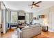 Bright and airy living room with hardwood floors and a cozy seating area at 132 Spring St, Charleston, SC 29403