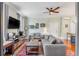 Open living room with hardwood floors and comfortable seating for multiple guests at 132 Spring St, Charleston, SC 29403