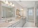 Double vanity bathroom with granite countertop and large mirrors at 1363 Rivella Dr, Mount Pleasant, SC 29464