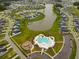 Aerial view of community with lake, pool, and playground at 153 Belfort Pl, Summerville, SC 29486