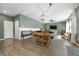 Open dining area with farmhouse table and access to the backyard at 153 Belfort Pl, Summerville, SC 29486