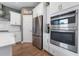 Modern kitchen with stainless steel appliances and white cabinetry at 153 Belfort Pl, Summerville, SC 29486