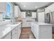 Modern kitchen featuring white cabinetry, quartz countertops, and stainless steel appliances at 153 Belfort Pl, Summerville, SC 29486