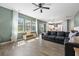 Spacious living room with hardwood floors, large windows, and a comfortable sectional sofa at 153 Belfort Pl, Summerville, SC 29486