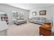Bright loft area with gray couches and a wooden toy chest at 153 Belfort Pl, Summerville, SC 29486