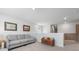 Spacious loft area with gray couch and wall art at 153 Belfort Pl, Summerville, SC 29486