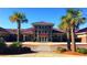 School entrance with palm trees and landscaping at 153 Belfort Pl, Summerville, SC 29486
