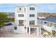 Elevated view of a three-story beach home with expansive decks at 1579 E Ashley Ave, Folly Beach, SC 29439