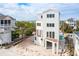 Elevated white beach house with spacious decks at 1579 E Ashley Ave, Folly Beach, SC 29439