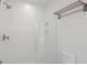 Clean bathroom with a glass shower and modern fixtures at 1579 E Ashley Ave, Folly Beach, SC 29439