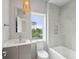 Bathroom with a single vanity, bathtub and window at 1579 E Ashley Ave, Folly Beach, SC 29439