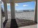 Covered patio overlooking beach through columns at 1579 E Ashley Ave, Folly Beach, SC 29439