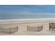 Oceanfront view with sandy beach and dune fencing at 1579 E Ashley Ave, Folly Beach, SC 29439