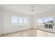 Bedroom with ocean views, hardwood floors, and ceiling fan at 1579 E Ashley Ave, Folly Beach, SC 29439