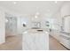 Modern white kitchen with marble island and ocean view at 1579 E Ashley Ave, Folly Beach, SC 29439