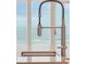 Modern kitchen faucet with ocean view in the background at 1579 E Ashley Ave, Folly Beach, SC 29439