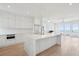 Modern kitchen with marble island, stainless steel appliances, and ocean views at 1579 E Ashley Ave, Folly Beach, SC 29439