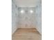 Small room with cloud wallpaper and light wood floors at 1579 E Ashley Ave, Folly Beach, SC 29439