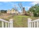 Grass backyard with a chain link and wooden fence at 194 Nassau St, Charleston, SC 29403