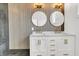 Elegant bathroom with double vanity, large mirrors, and wood-paneled walls at 194 Nassau St, Charleston, SC 29403
