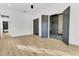 Main bedroom with hardwood floors, double doors to en-suite bathroom at 194 Nassau St, Charleston, SC 29403