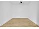 Bright, empty bedroom with light hardwood floors and ceiling fan at 194 Nassau St, Charleston, SC 29403