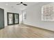 Bedroom with hardwood floors, French doors and two windows at 194 Nassau St, Charleston, SC 29403