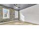 Bright bedroom with brick accent wall, hardwood floors, and large windows at 194 Nassau St, Charleston, SC 29403
