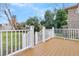 Spacious deck with wood flooring and a white railing at 194 Nassau St, Charleston, SC 29403
