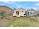 Newly renovated light beige house with a white deck and steps in the backyard at 194 Nassau St, Charleston, SC 29403