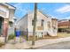Newly renovated light beige house with white steps and a blue recycling bin at 194 Nassau St, Charleston, SC 29403
