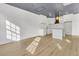Modern kitchen with white cabinets, quartz countertops, and a statement range hood at 194 Nassau St, Charleston, SC 29403