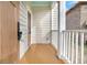 Inviting front porch with wood flooring and white railing at 194 Nassau St, Charleston, SC 29403