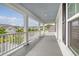 Spacious porch with white railings and gray decking, overlooking a neighborhood at 205 Oak View Way, Summerville, SC 29483