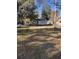Large backyard with grassy area and a partially visible house at 206 Palmetto St, Moncks Corner, SC 29461