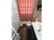 Bathroom with pink toilet and floral shower curtain at 206 Palmetto St, Moncks Corner, SC 29461