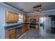 Kitchen with stainless steel appliances and light wood cabinets at 225 Pimpernel St, Summerville, SC 29483