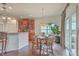 Bright dining area with hardwood floors and sliding glass door access to the outdoors at 240 Mayfield Dr, Goose Creek, SC 29445