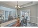 Spacious dining room with a view into the entryway and a large window at 240 Mayfield Dr, Goose Creek, SC 29445