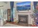 Living room fireplace with a large TV above it and holiday decor at 240 Mayfield Dr, Goose Creek, SC 29445